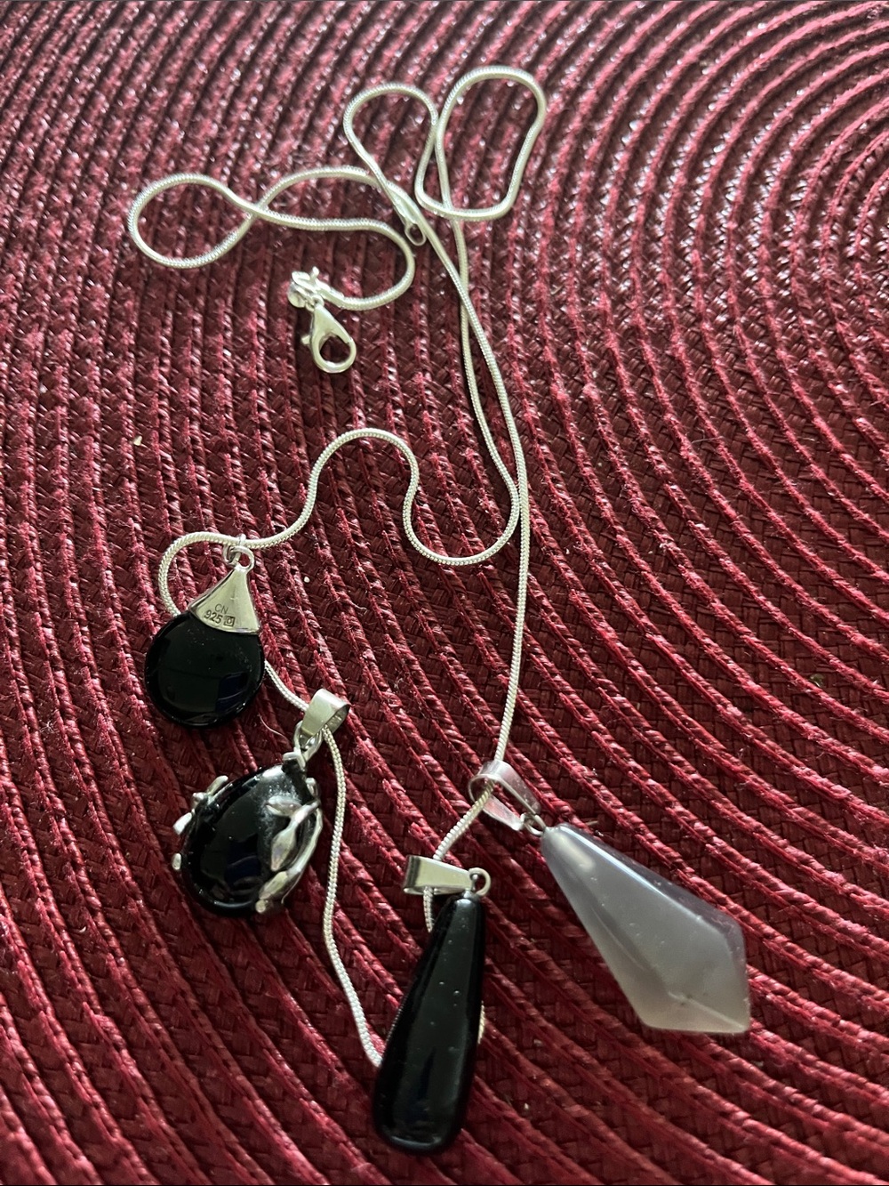 Sterling Silver long necklace dangling onyx in sterling charms.